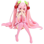 Hatsune and Miku figurine featuring vibrant pink hair and cherry accessories, perfect for collectors