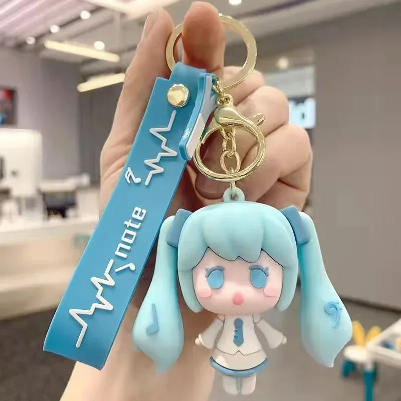 Hatsune and Miku cute figurine keychain with blue accents and a blue strap for fans