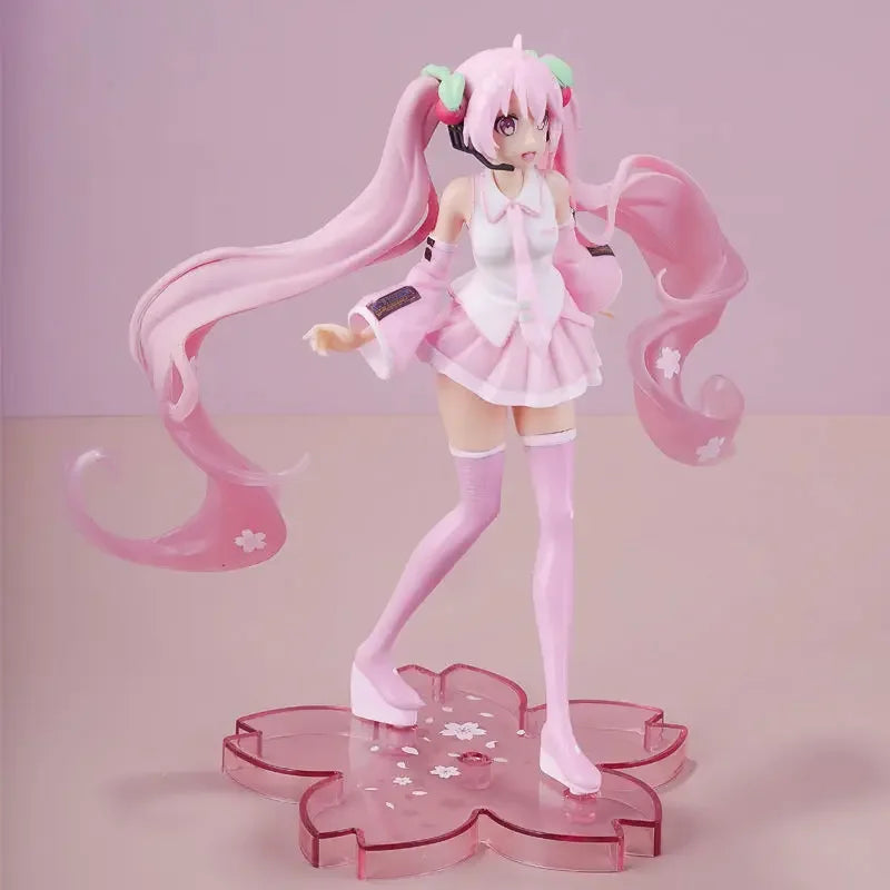 Cute Hatsune and Miku figurine in pink outfit with long hair on a flower-shaped base