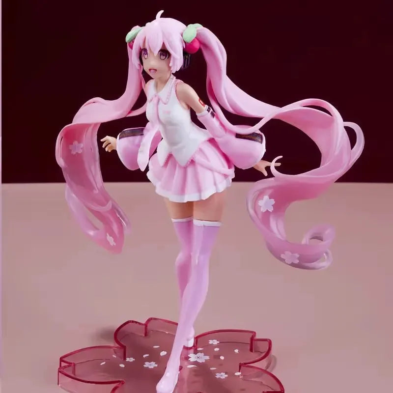 Hatsune and Miku collectible figurine with pink hair and floral-themed base display