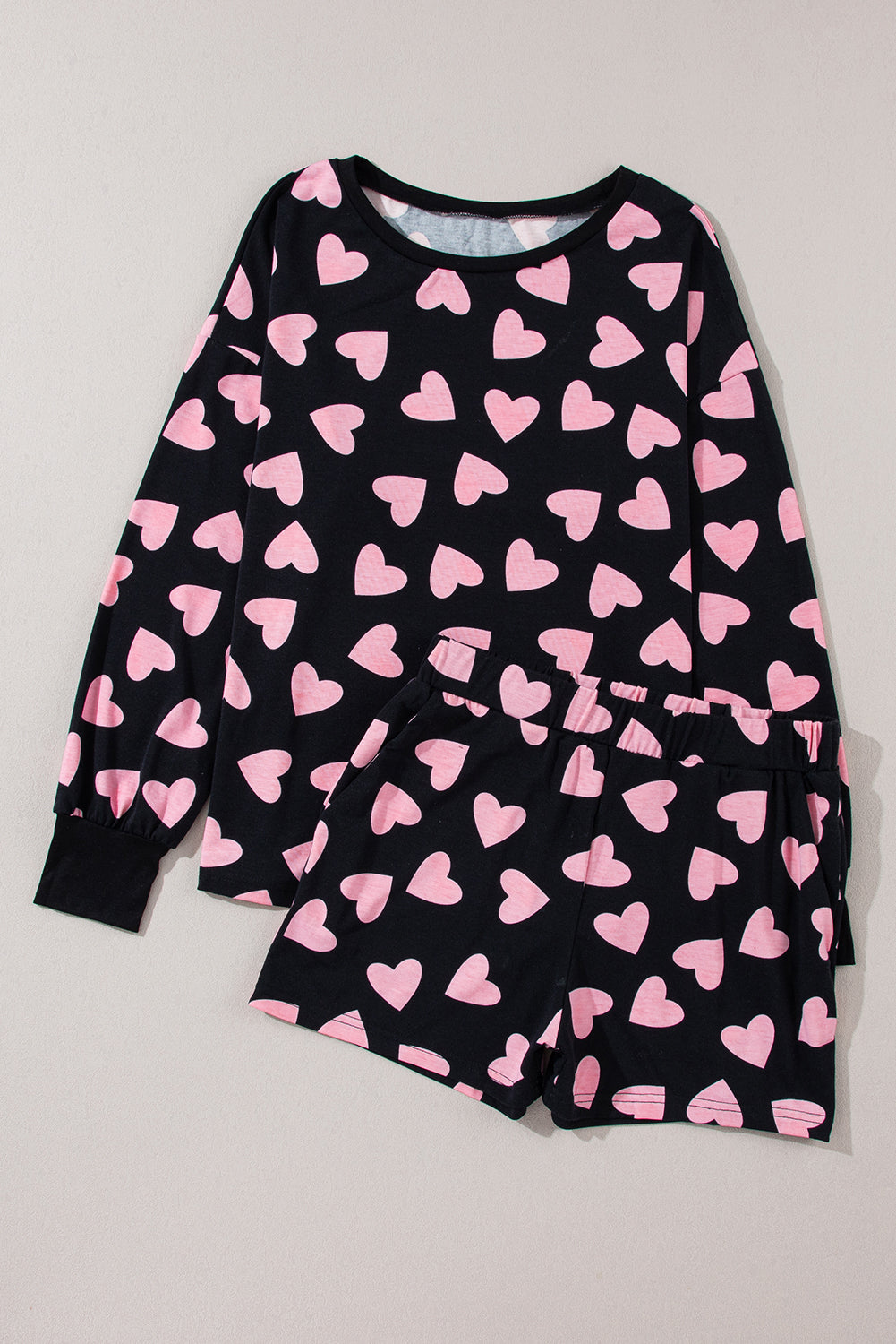 LuckeLadybug LLC Heart to print shorts set with long sleeve top featuring pink hearts on a black background