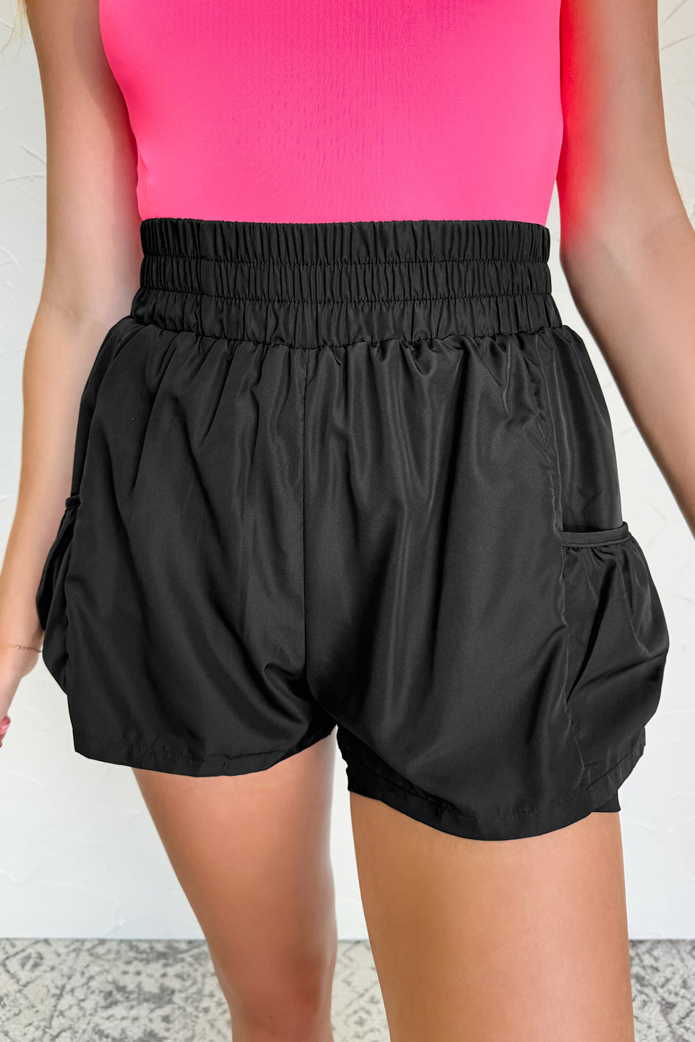 Black high-waist shorts from LuckeLAdybug LLC featuring an elastic waistband and side pockets