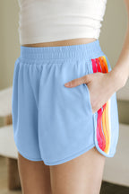 Light blue high-waist shorts with rainbow stripes and side pockets for casual summer wear