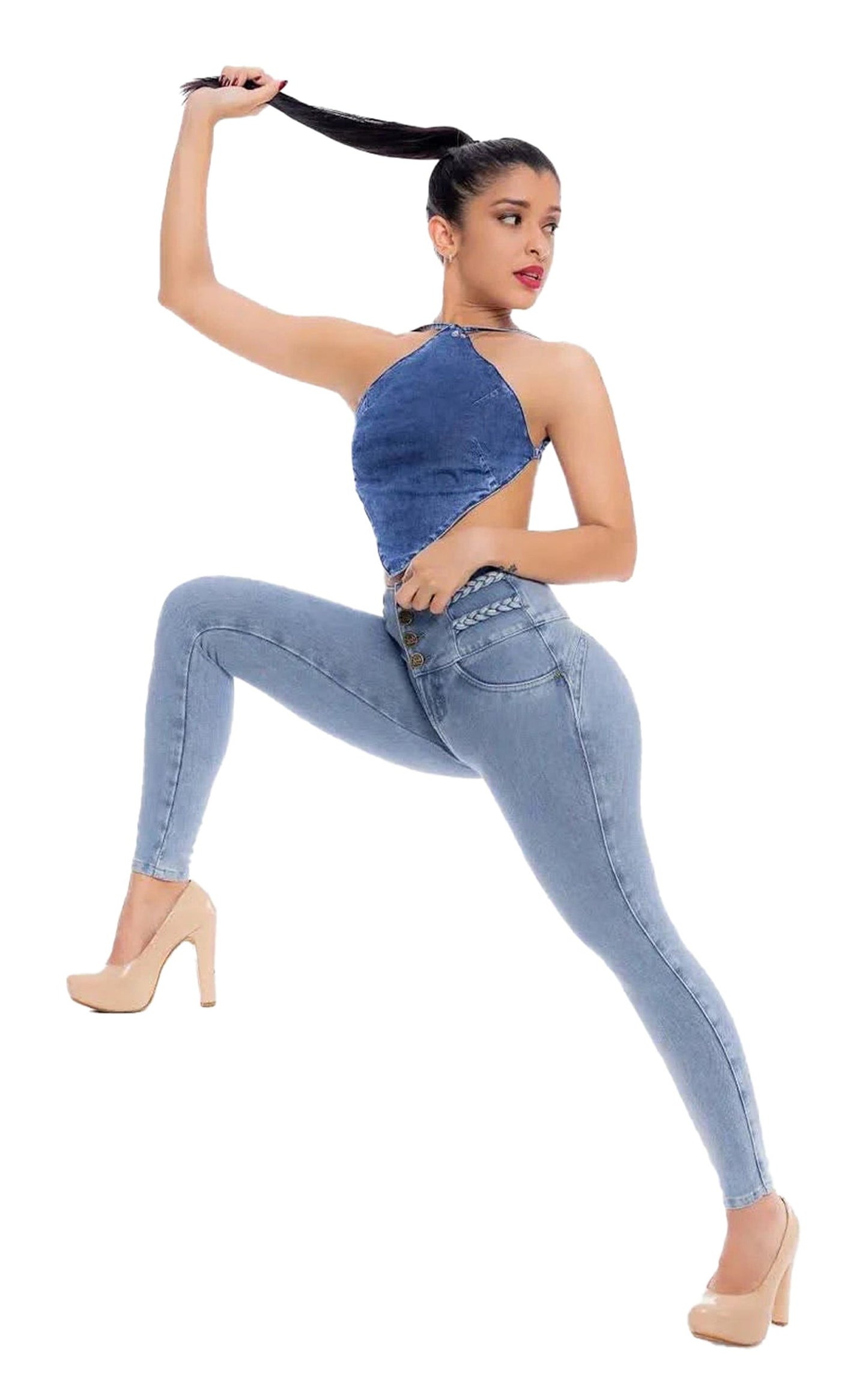 Model wearing high waisted skinny jeans for women with a stylish top and heels, showcasing a modern look