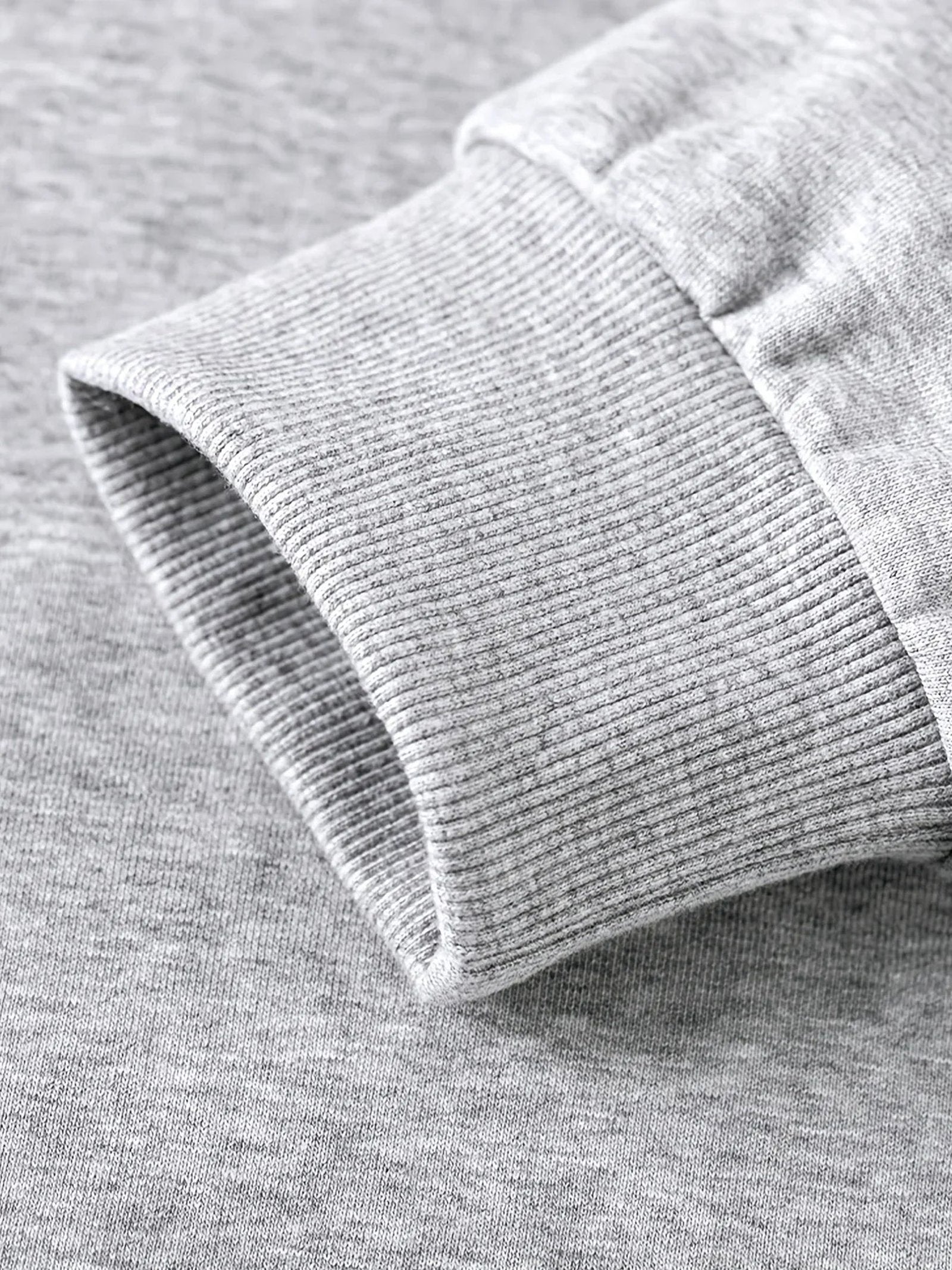Close-up of a gray hockey mom hoodie showcasing the soft ribbed cuff design
