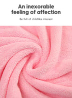 Soft pink hooded newborn towel made from plush material for gentle drying and warmth