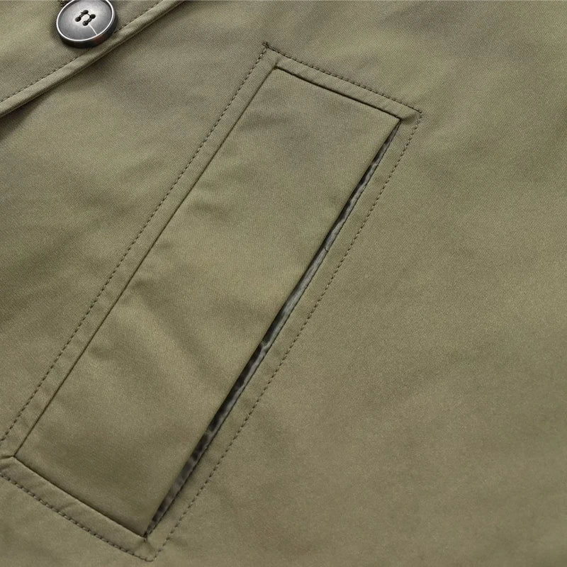 Close-up of women's cropped windbreaker jacket with a stylish front pocket detail