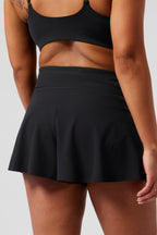 Black skort from LuckeLadybug LLC featuring a flared design and high waist for comfort and style