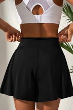 Black skort with high waist design, perfect for active wear and stylish outfits, featuring a sporty look
