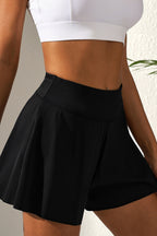 LuckeLadybug LLC black skort featuring a high waist design, perfect for active wear and casual outings