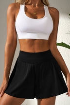 LuckeLadybug LLC black skort featuring a high waist design for a stylish look with jeans with high waist