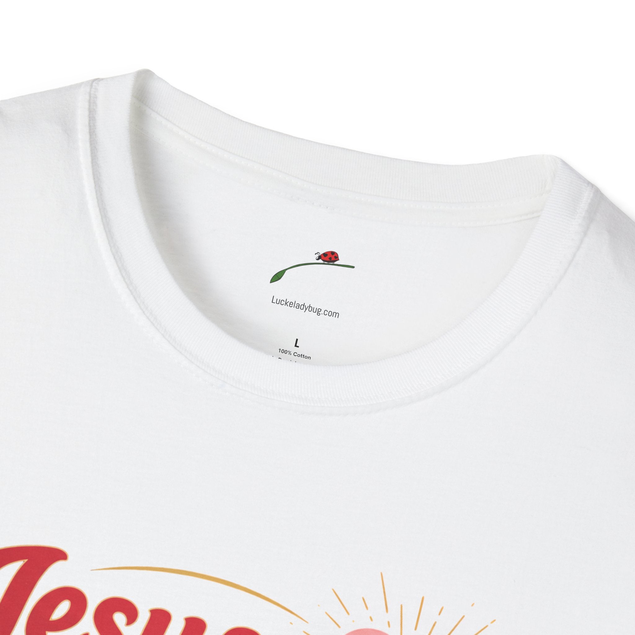 Close-up of white Jesus is Love t-shirt collar and part of printed design by LuckeLadybug