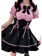 Jirai Kei kawaii pinafore dress in black and pink with bows and lace-up details for trendy fashion lovers