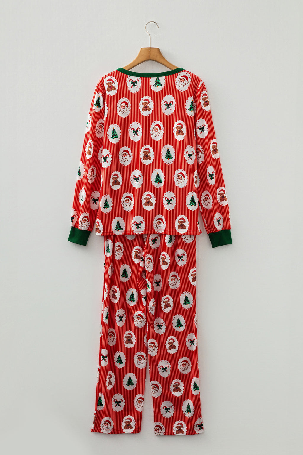 Festive red jogger pants baggy with Christmas pattern featuring trees and Santa faces