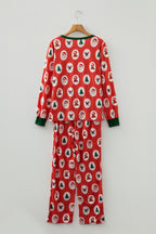 Festive red jogger pants baggy with Christmas pattern featuring trees and Santa faces