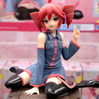 Kasane Teto Figurine by LuckeLadybug LLC in a seated pose with vibrant red hair and stylish outfit
