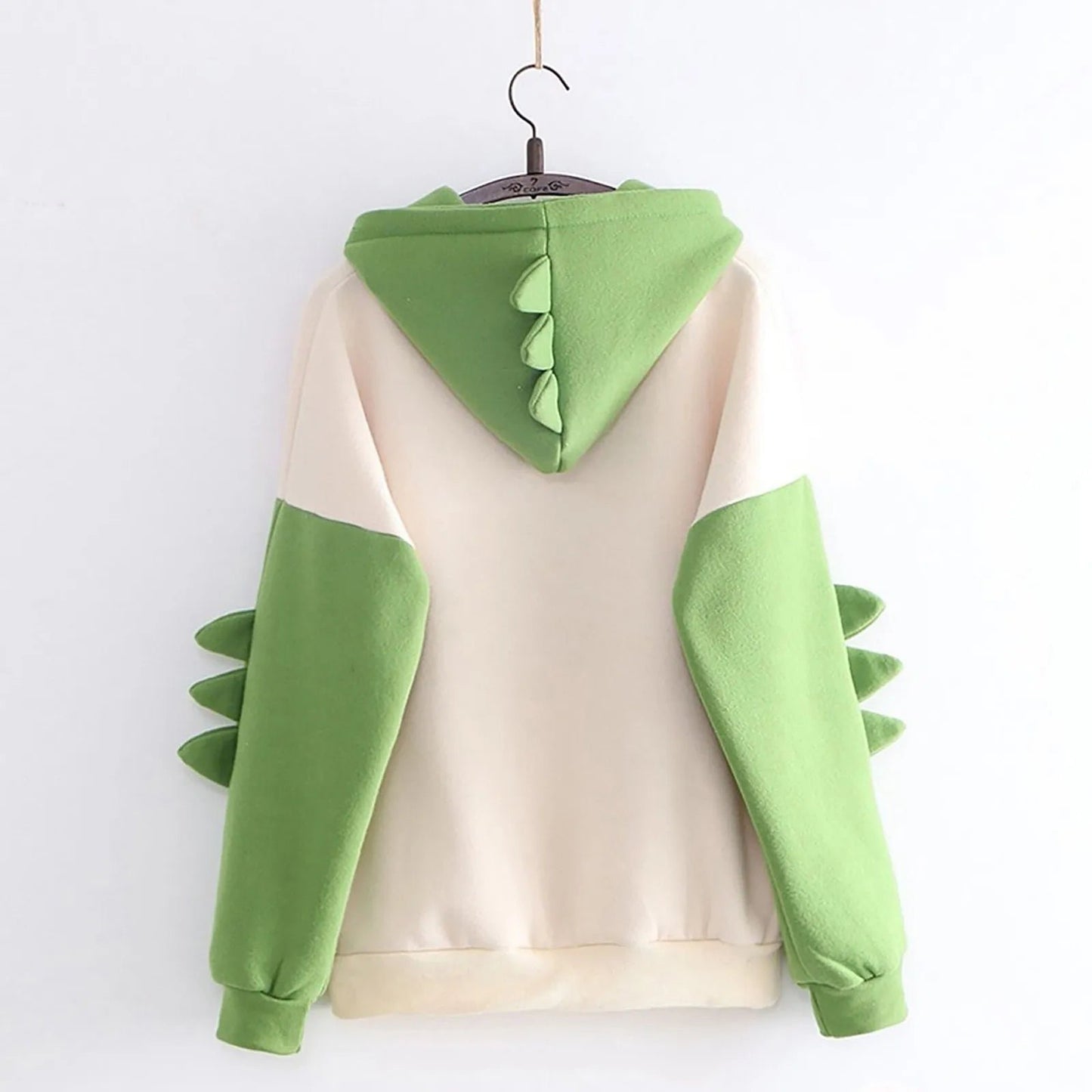 Back view of kawaii dinosaur hoodie for women featuring a playful green design with spikes on the hood and sleeves