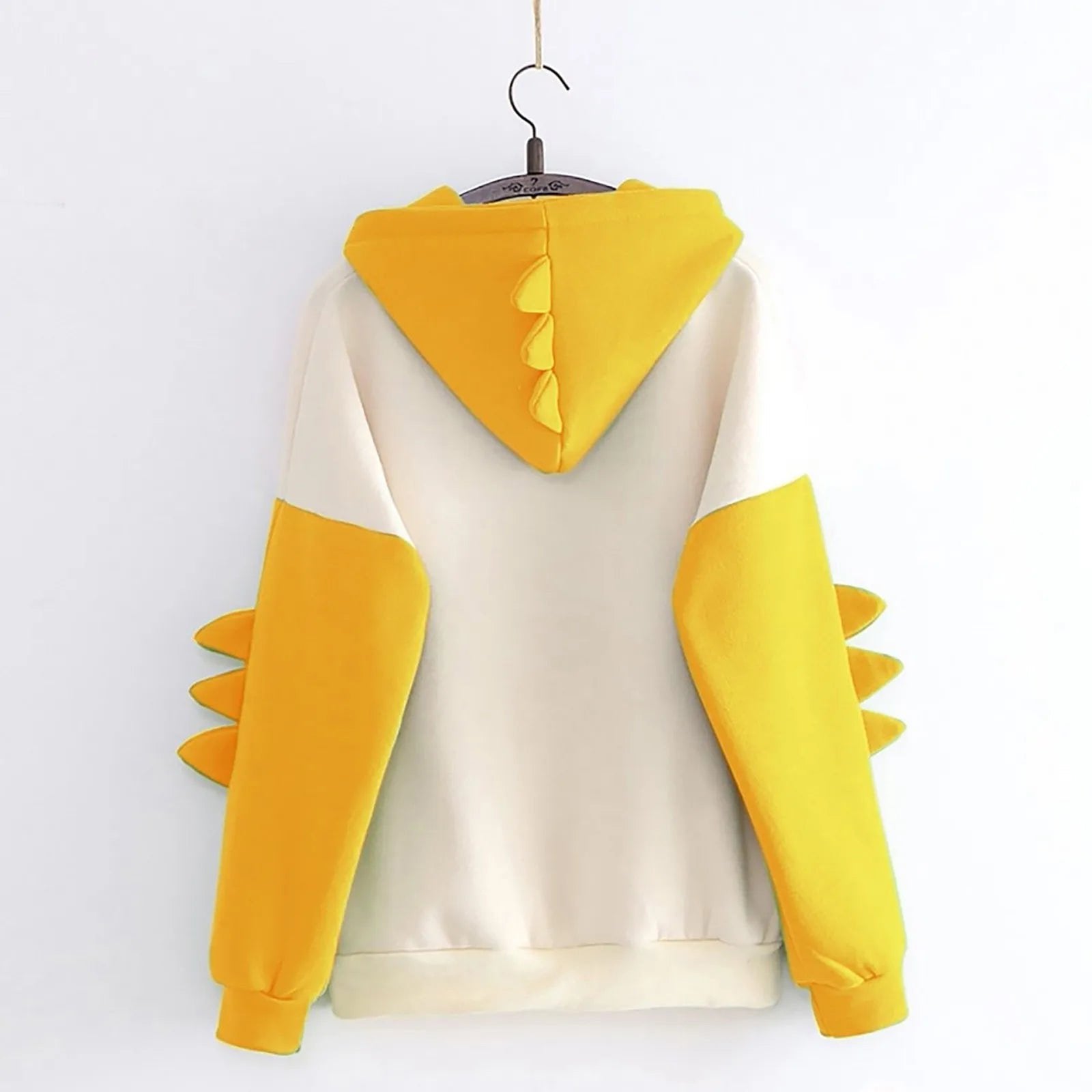 Back view of kawaii dinosaur hoodie for women in yellow and cream with spiky details