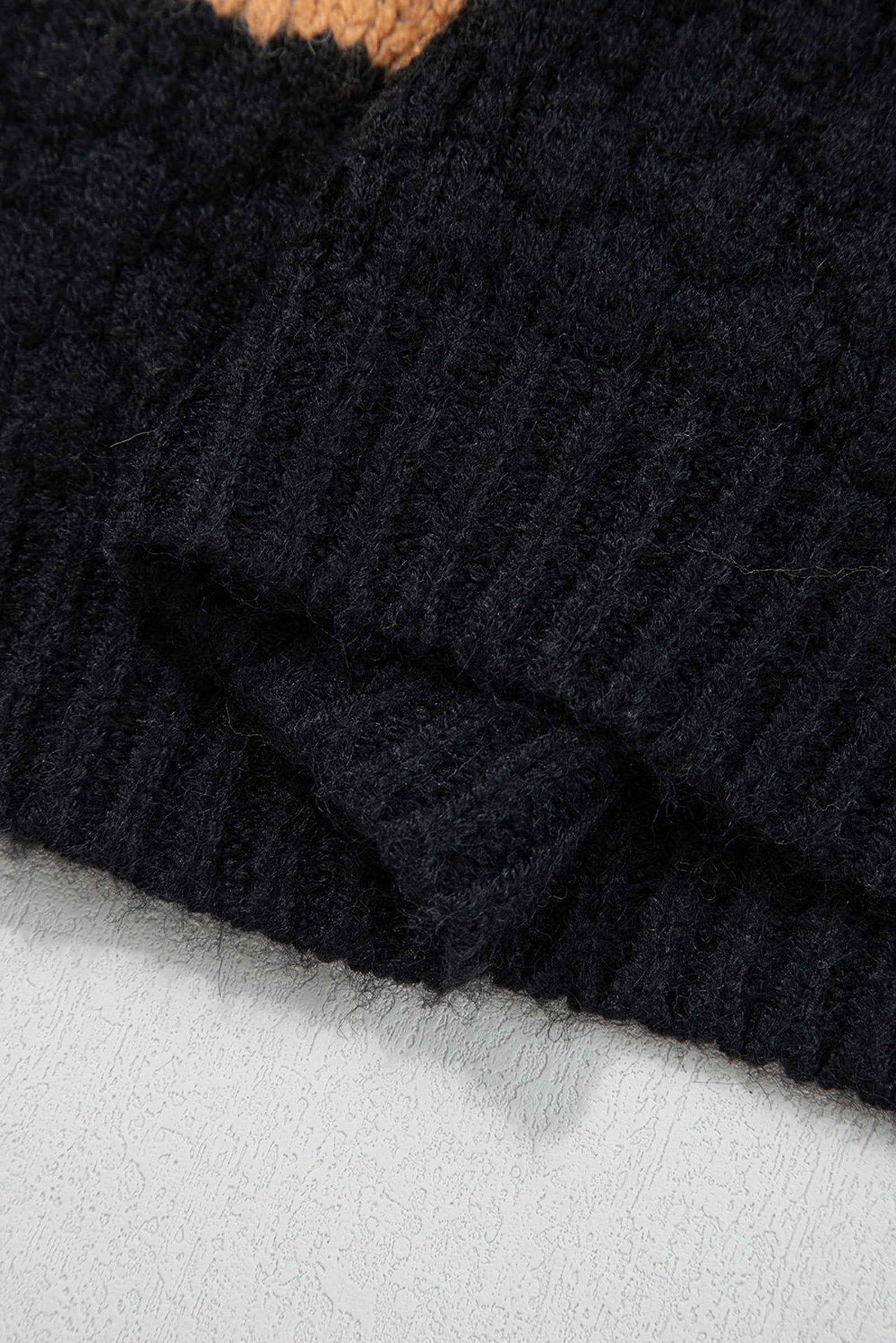 Close-up of the khaki color block high neck sweater showcasing the ribbed texture and detail