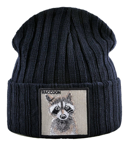 Navy knitted beanie hat with patch featuring a cute raccoon design from LuckeLadybug LLC