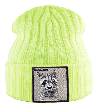 Bright yellow knitted beanie hat with patch featuring a raccoon design from LuckeLadybug LLC