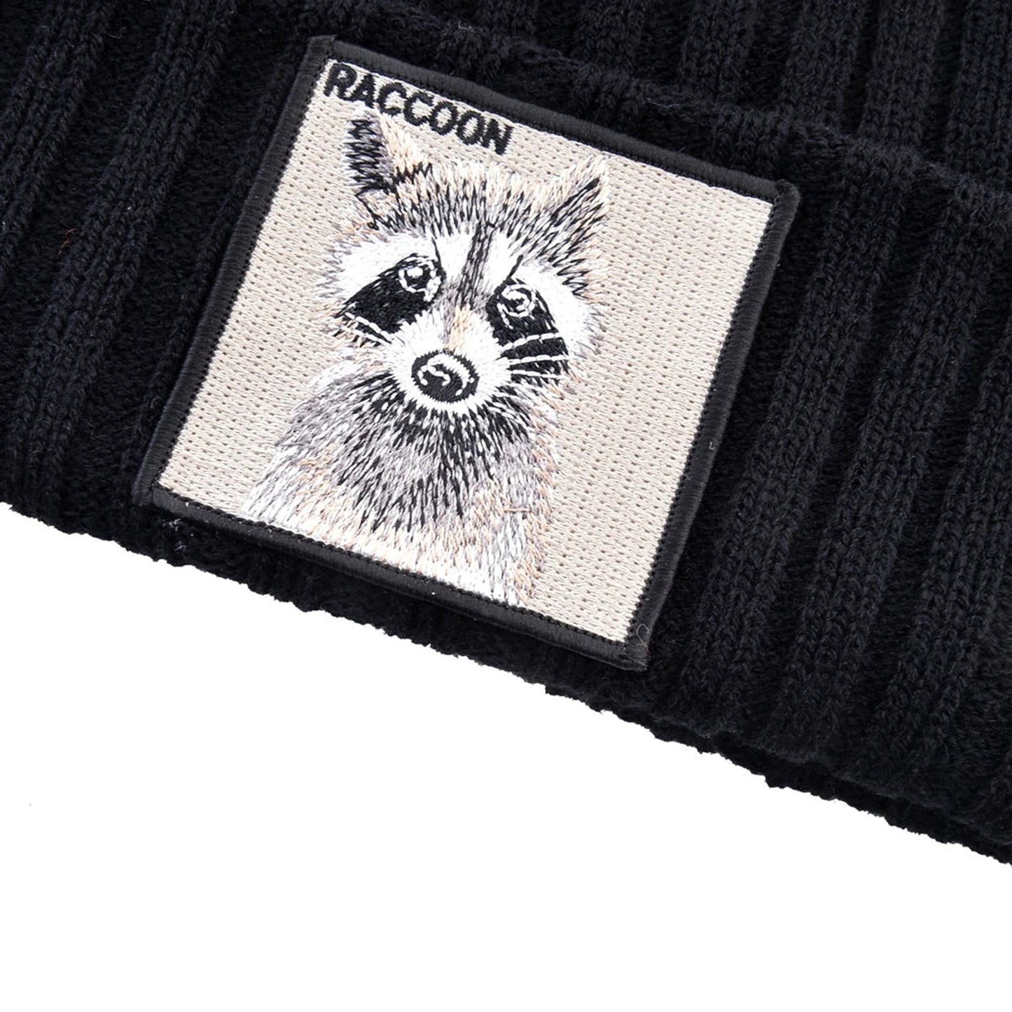 LuckeLadybug LLC black knitted beanie hat with patch featuring a raccoon illustration
