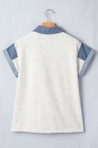Back view of a ladies denim blouse with short sleeves and a stylish collar design