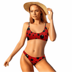 ladybug bikini swimsuit with red and black spotted design worn by woman with sun hat