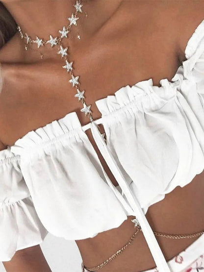 White lantern sleeve crop top for women with ruffled neckline and tied front detail