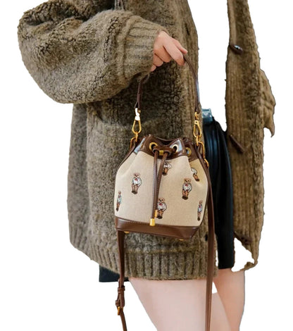 Stylish large capacity drawstring bucket bag with decorative patterns, perfect for everyday use