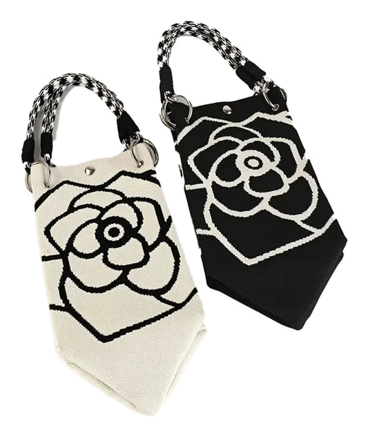 Large knitted tote bag for women featuring a floral design in black and white with stylish handles