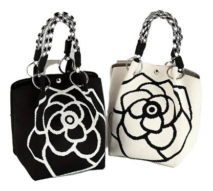 Large knitted tote bag for women featuring black and white floral design with stylish handles