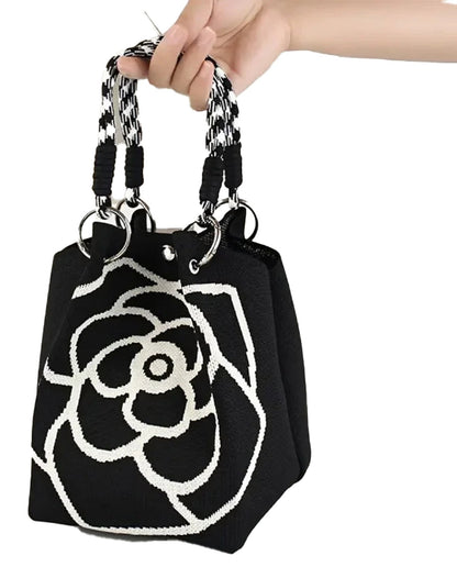 Stylish black and white large knitted tote bag for women with unique floral design and braided handles