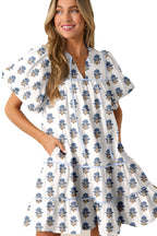 LuckeLadybug sky blue floral mini dress with puff sleeves tiered ruffle skirt and side pockets on model