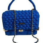 Handmade leather handbag handmade in vibrant blue with a stylish chain strap and textured design