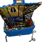 Handmade leather handbag with colorful interior design showcasing intricate patterns