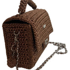 Brown leather woven purse with a stylish chain strap and unique texture for elegant occasions