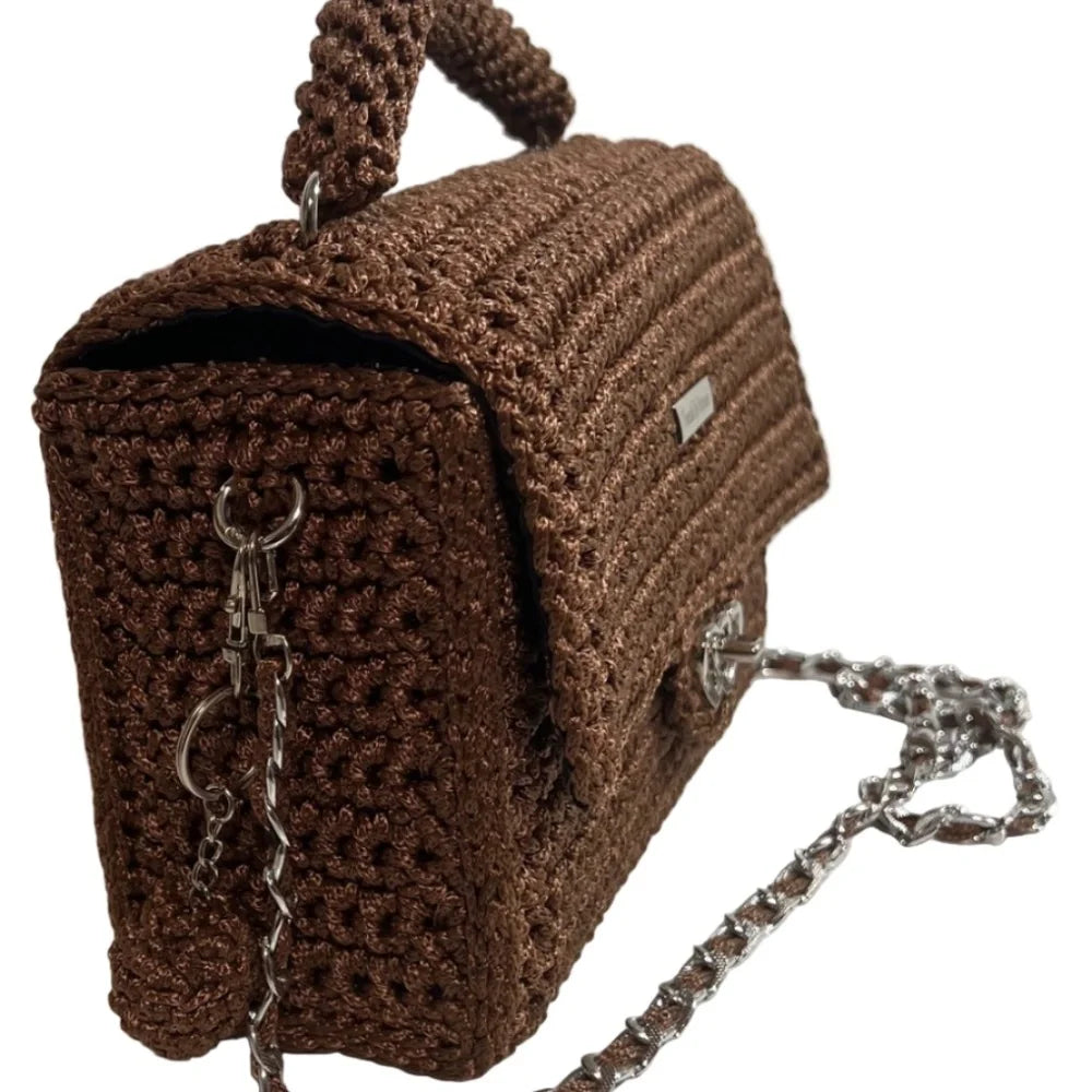 Brown leather woven purse with a stylish chain strap and unique texture for elegant occasions