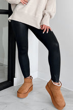 Black leggings high waist styled with a cozy sweater and trendy platform boots