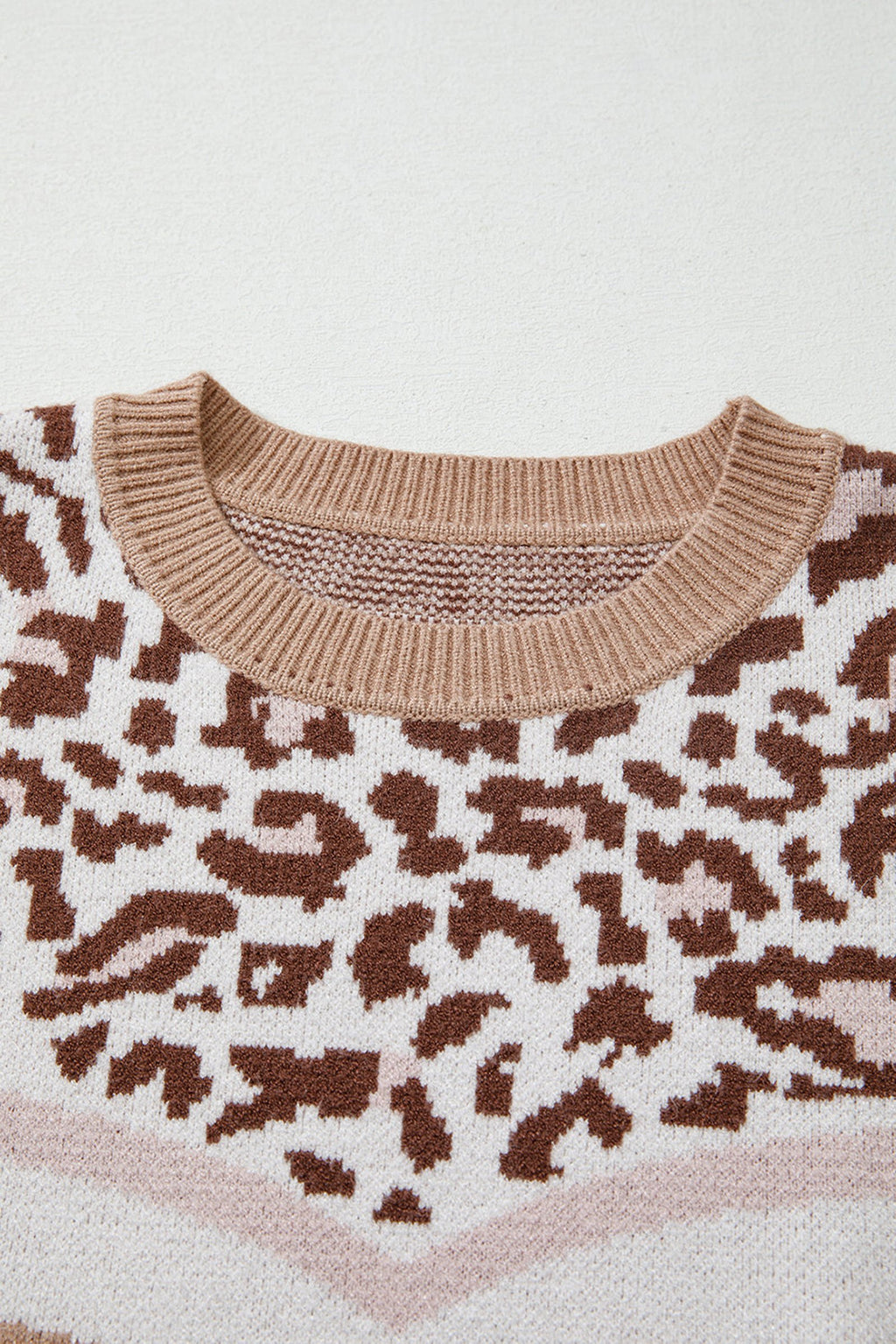Leopard print color block sweater with soft fabric and cozy crewneck design