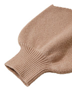 Soft taupe fabric of the leopard print color block sweater with ribbed cuffs