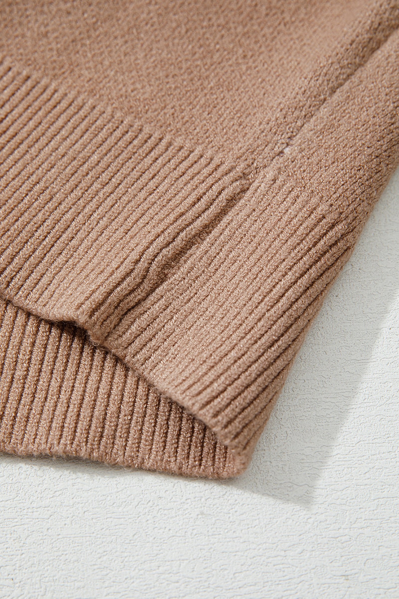 Close-up of a soft fabric texture of a leopard print color block sweater by LuckeLadybug LLC