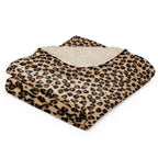 LuckeLadybug leopard print sherpa blanket folded showing soft cream sherpa lining