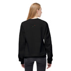 Back view of woman wearing black let them butterfly sweater by LuckeLadybug with small embroidered design