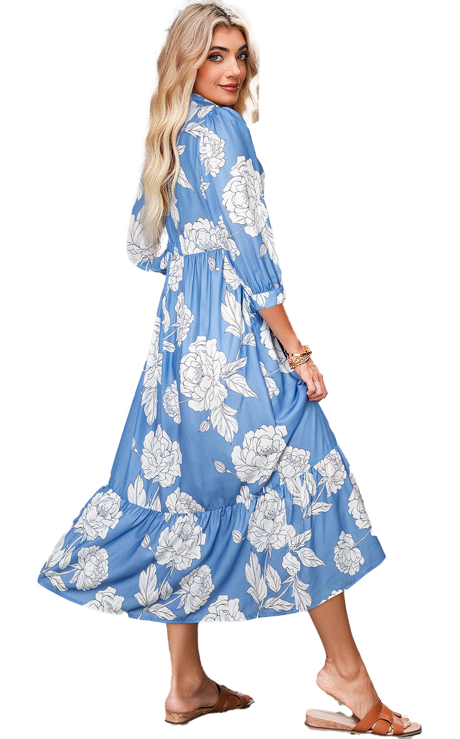 LuckeLadybug model wearing a sky blue floral maxi dress with white large flowers long sleeves and flowy skirt