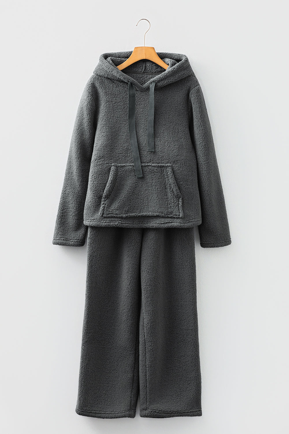 Cozy dark gray lounge pants with matching hoodie for relaxed comfort at home