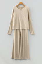 Beige lounge room set featuring a cozy long-sleeve top and wide-leg pants for relaxed comfort
