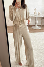 Cozy beige lounge room set featuring a relaxed top and wide-leg pants, perfect for casual lounging
