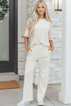 Beige lounge room set featuring a cozy oversized top and wide-leg pants for comfortable lounging