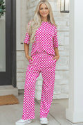 Stylish pink checkered lounge room set featuring relaxed fit pants and a matching top